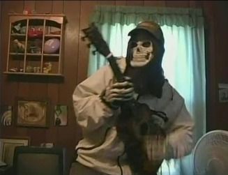 The Grim Reaper plays guitar left handed